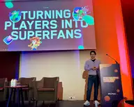 Ryan Lighton presenting at GPMC London 2026, under a slide that reads "Turning players into superfans"